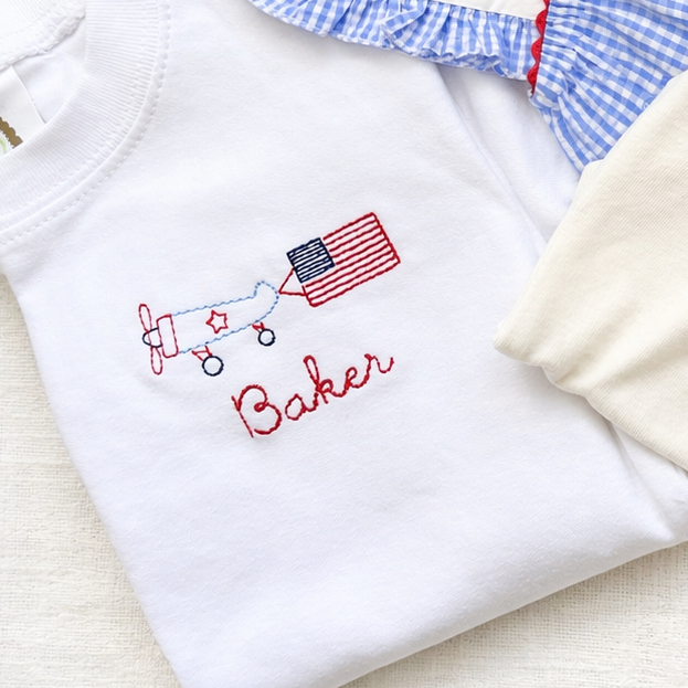 Children's clothing set with embroidered names on a white background