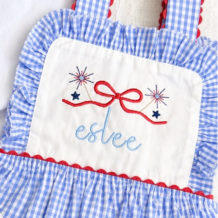 Children's clothing set with embroidered names on a white background